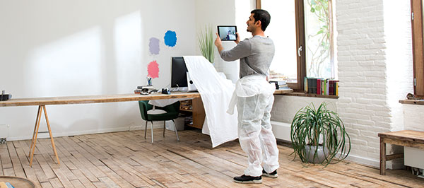 man-looking-at-wall-on-tablet